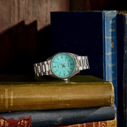 Casio turquoise dial watch styled with vintage books